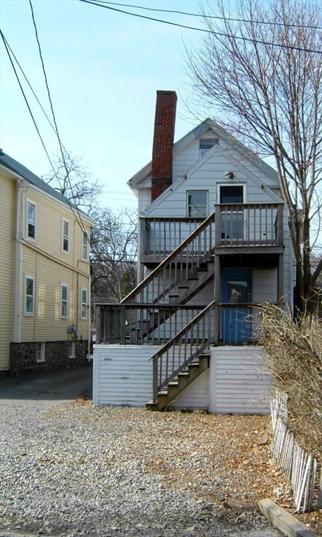 128 Pleasant Street, Unit 2 Marblehead, MA 01945 - Photo 13 of 13 a view of a house with a yard