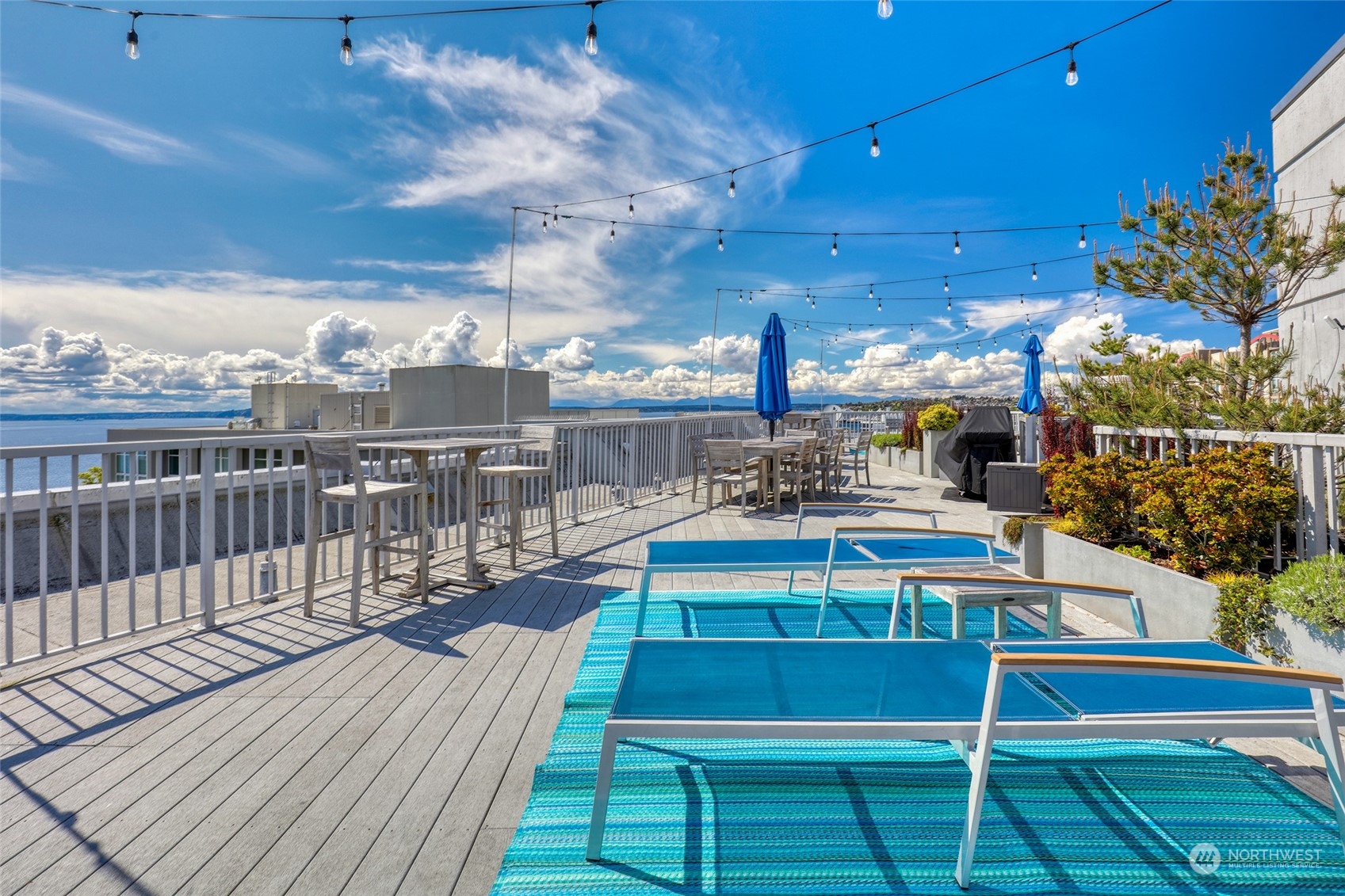 76 Cedar Street, Unit 710 Seattle, WA 98121 - Photo 16 of 20 a view of a balcony with wooden floor and city view