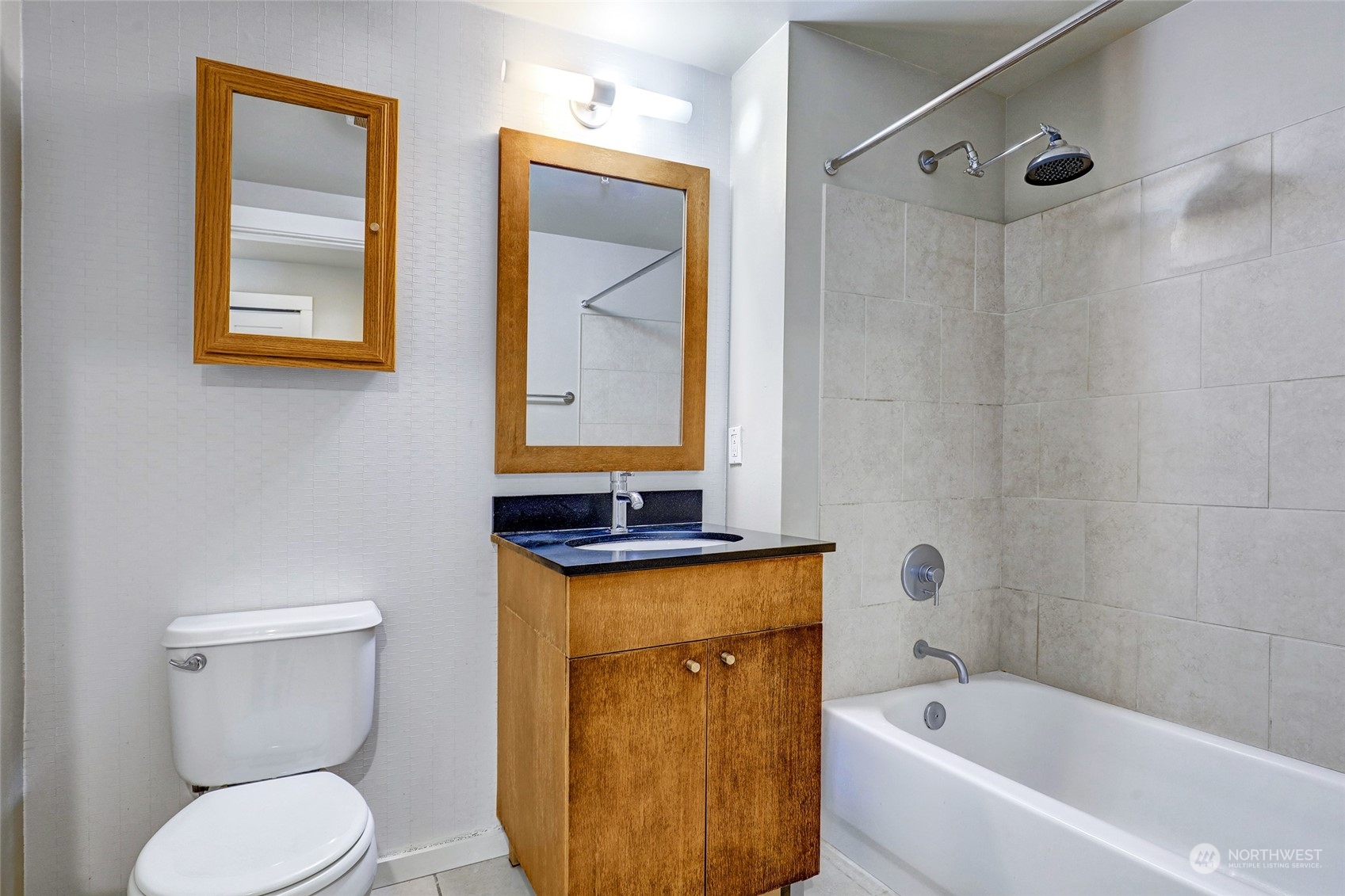 76 Cedar Street, Unit 710 Seattle, WA 98121 - Photo 9 of 20 a bathroom with a toilet sink and mirror