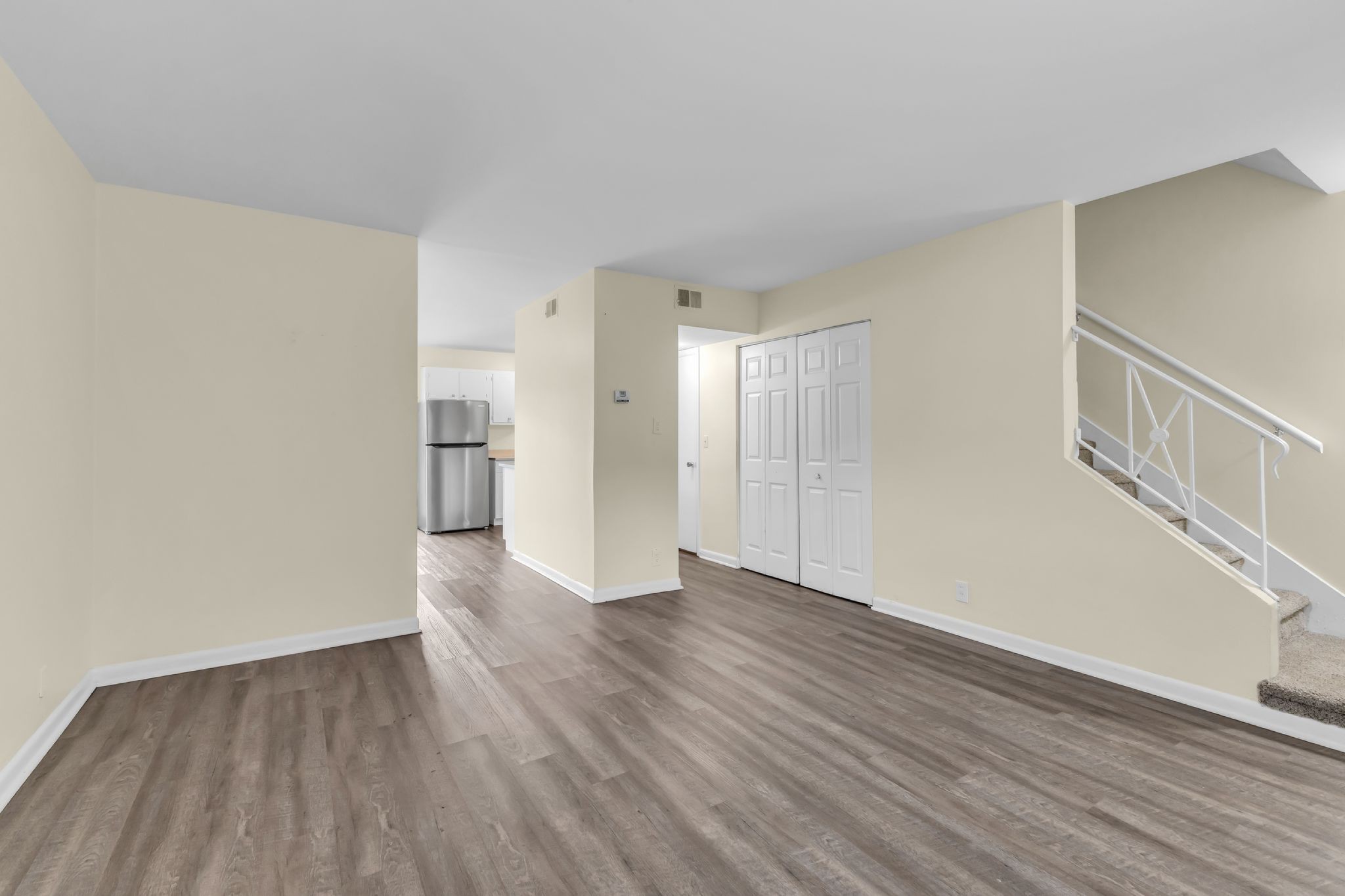 370 Wallace Road, Unit F5 Nashville, TN 37211 - Photo 11 of 28 a view of an empty room with wooden floor and a window
