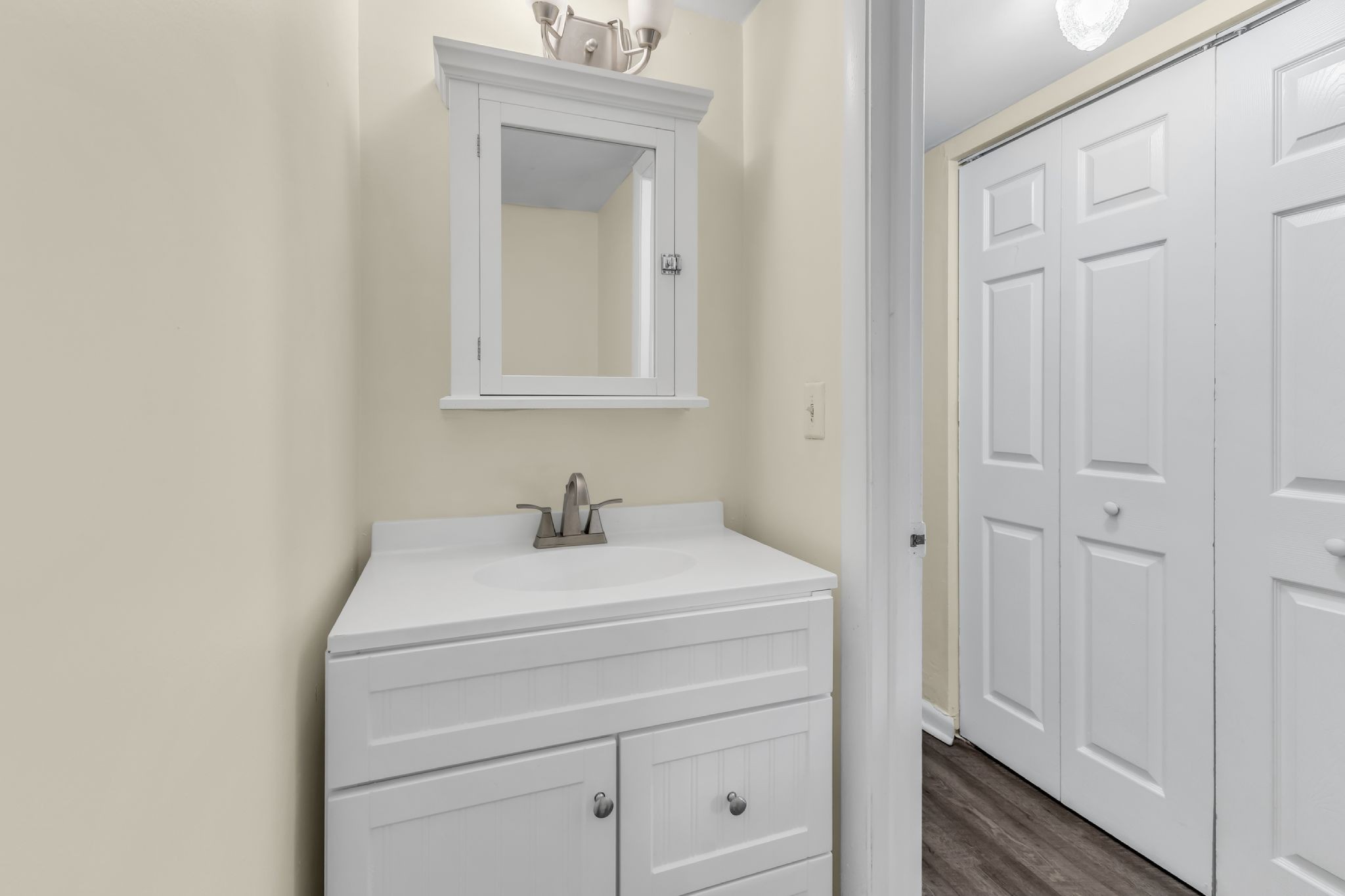 370 Wallace Road, Unit F5 Nashville, TN 37211 - Photo 13 of 28 a bathroom with a sink a vanity and a mirror