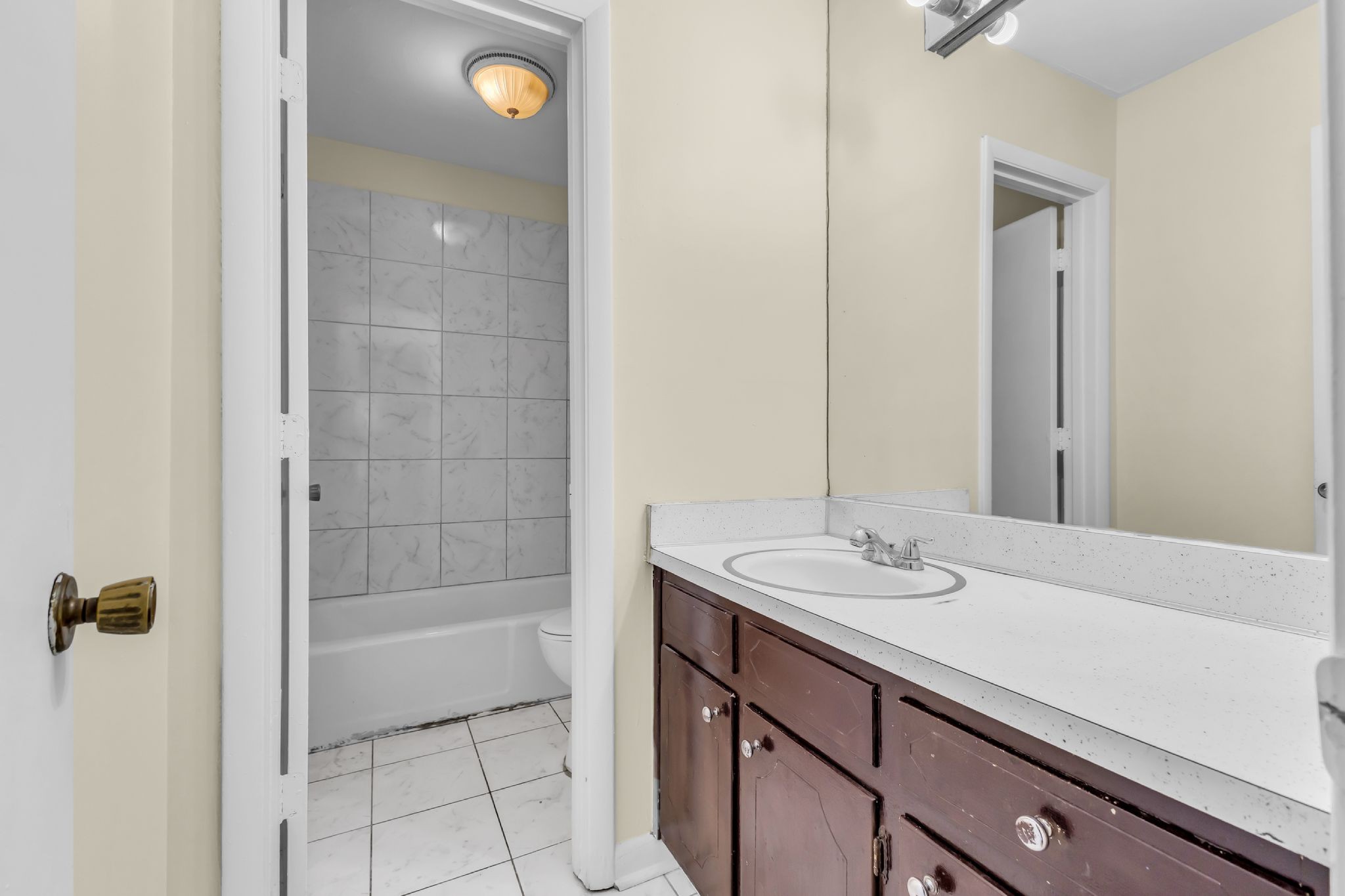 370 Wallace Road, Unit F5 Nashville, TN 37211 - Photo 19 of 28 a bathroom with a sink a shower and a mirror