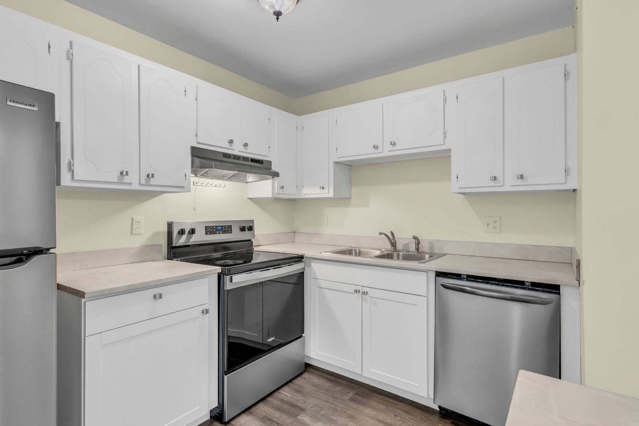 370 Wallace Road, Unit F5 Nashville, TN 37211 - Photo 2 of 28 a kitchen with cabinets stainless steel appliances and sink
