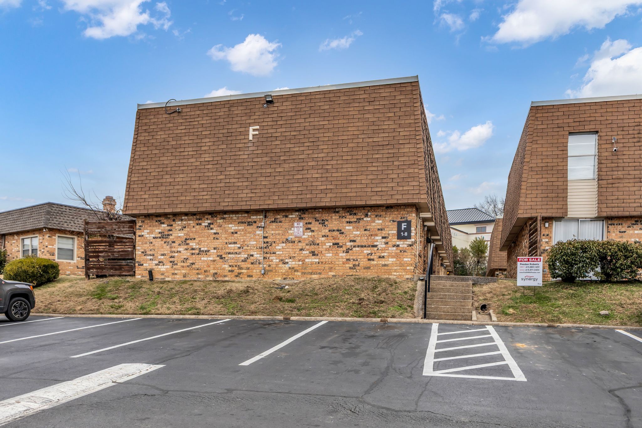 370 Wallace Road, Unit F5 Nashville, TN 37211 - Photo 25 of 28 a view of a brick house with lots of windows