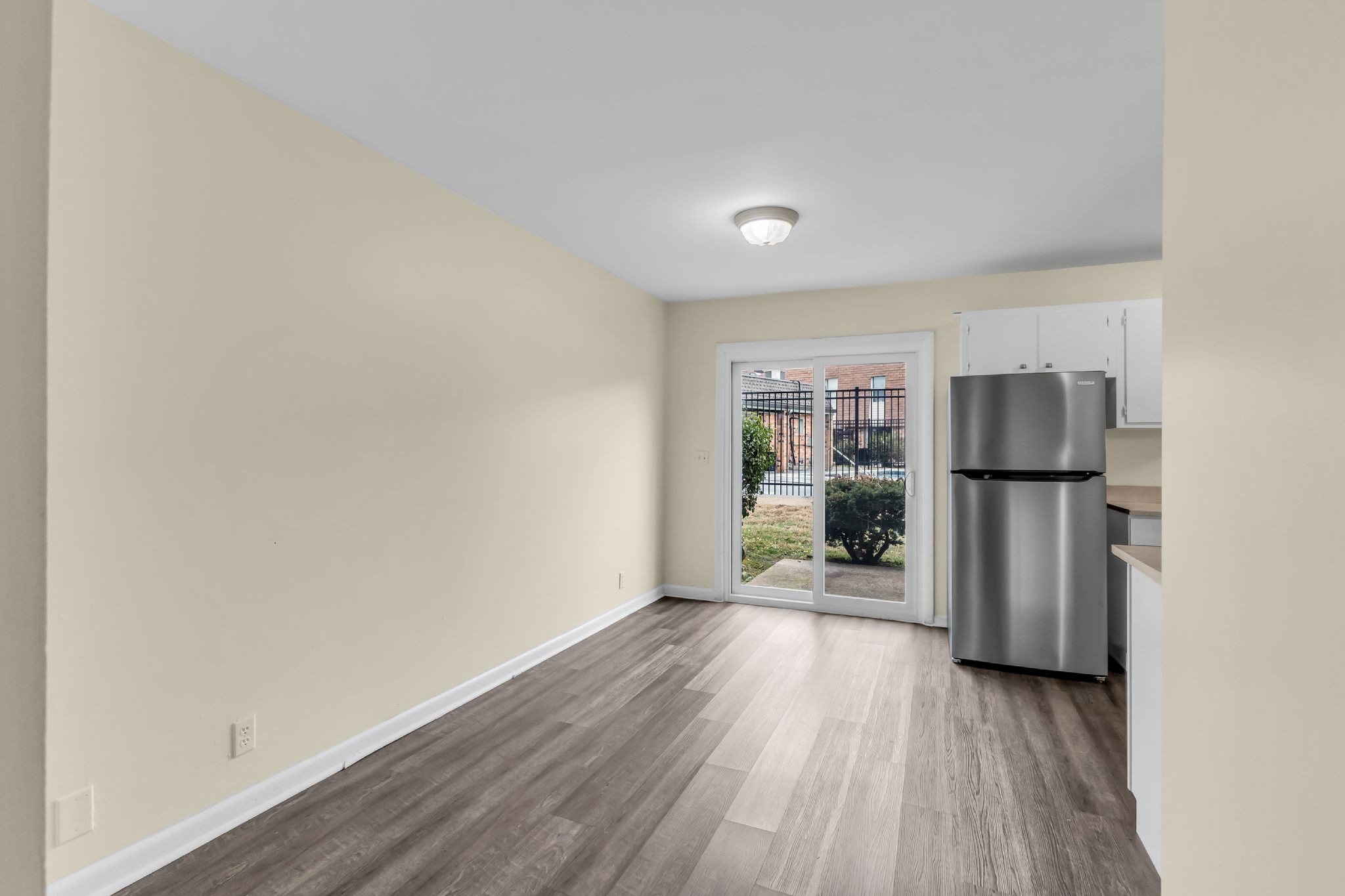 370 Wallace Road, Unit F5 Nashville, TN 37211 - Photo 6 of 28 a view of kitchen with refrigerator stove and wooden floor