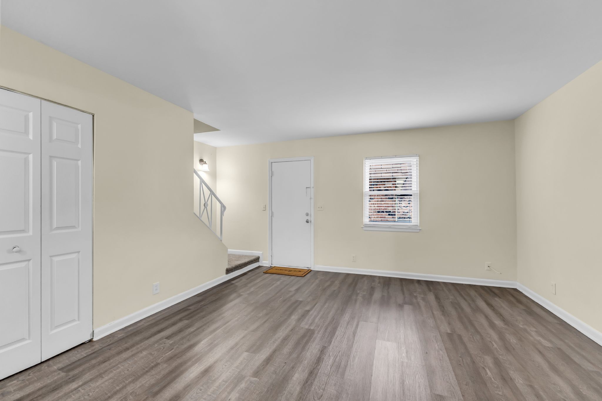 370 Wallace Road, Unit F5 Nashville, TN 37211 - Photo 9 of 28 an empty room with wooden floor and windows