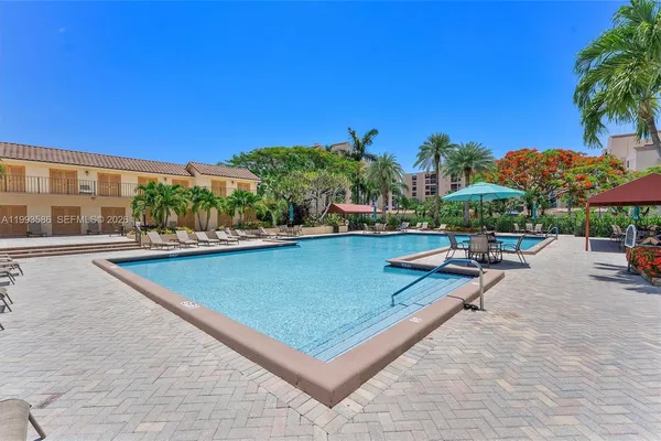 a view of a swimming pool with chairs