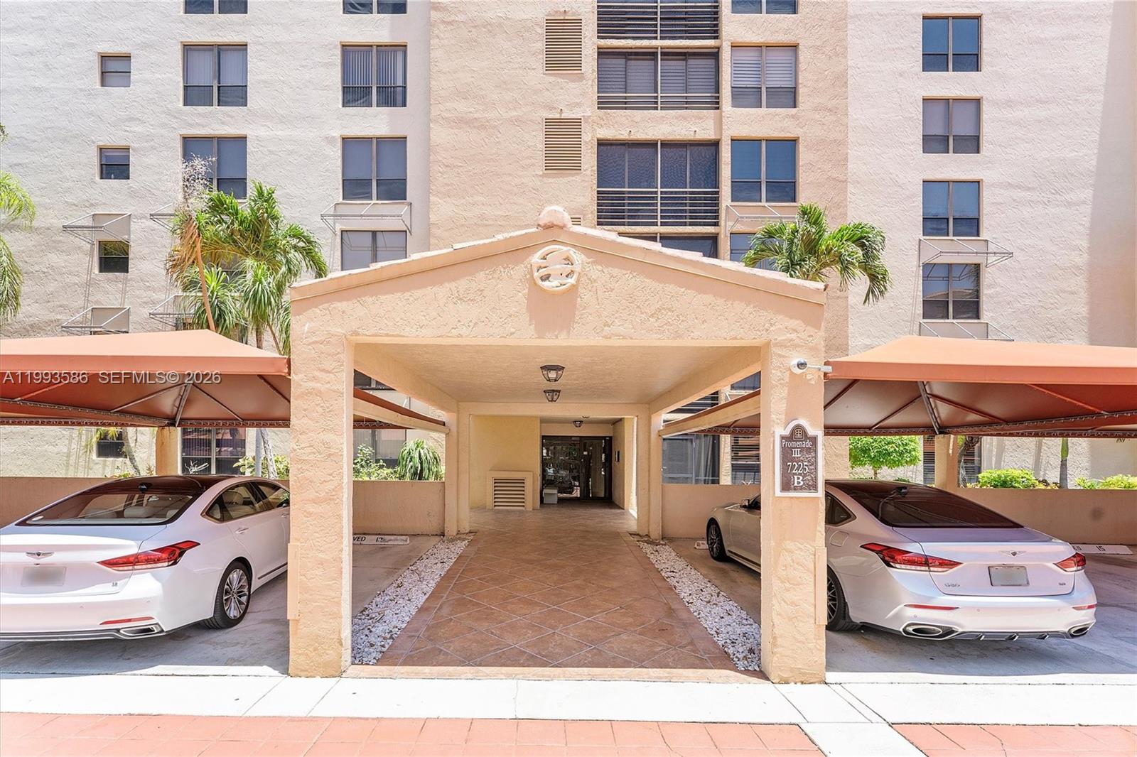 7225 Promenade Drive, Unit 102 Boca Raton, FL 33433 - Photo 21 of 21 a front view of a building with parking space