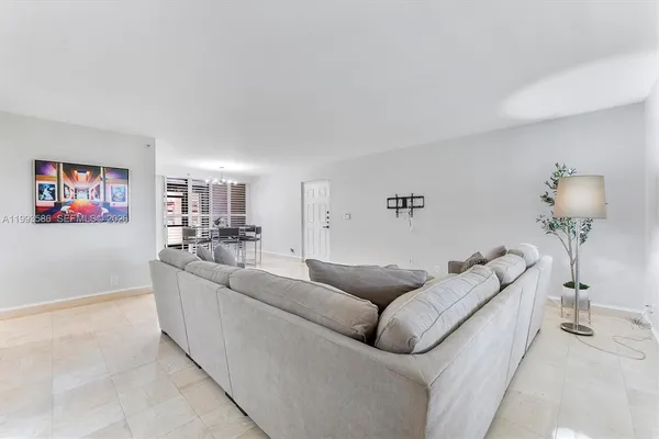 a view of a dining room with furniture and a livingroom