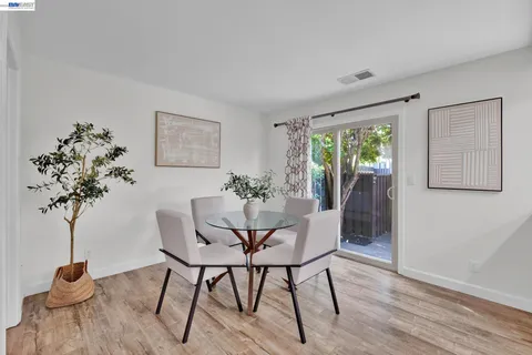 a view of a livingroom with furniture and a potted plant