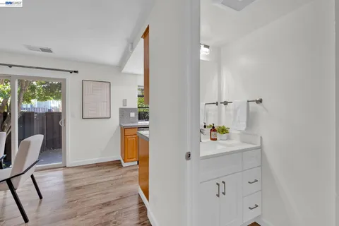 a view of kitchen and dining room with wooden floor