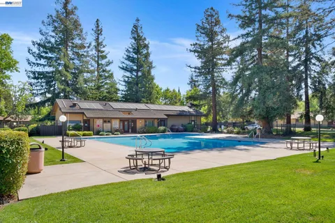 a view of a house with a yard porch and sitting area