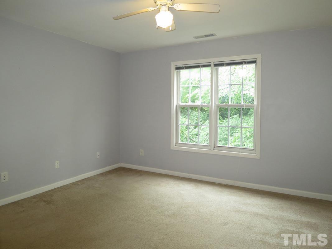 303 West Poplar Avenue, Unit B Carrboro, NC 27510 - Photo 11 of 16 an empty room with a window