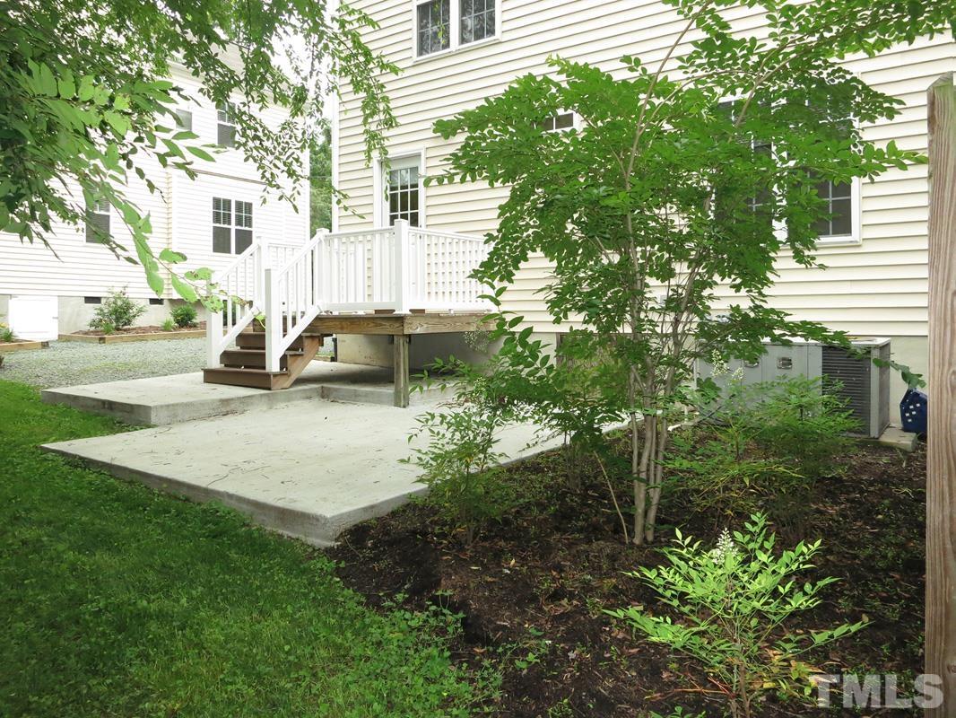 303 West Poplar Avenue, Unit B Carrboro, NC 27510 - Photo 15 of 16 a view of a house with a yard