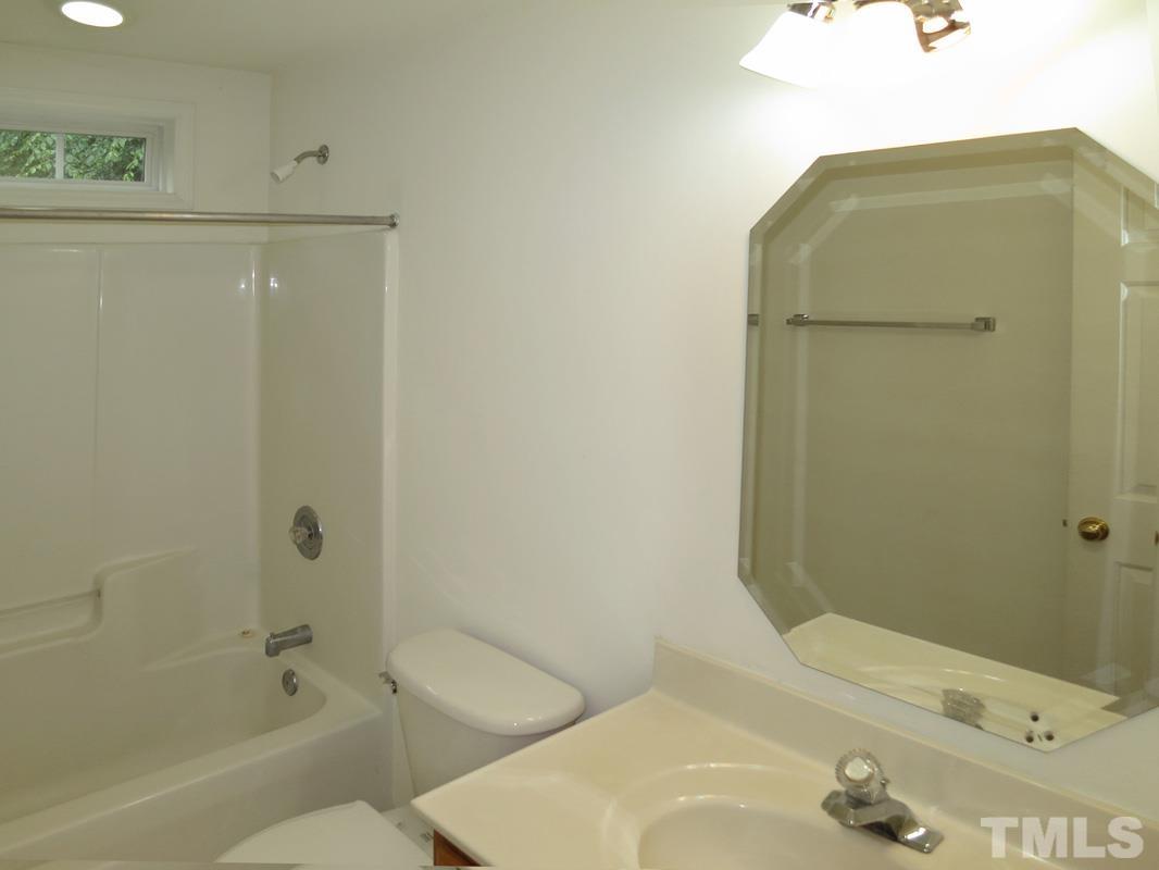 303 West Poplar Avenue, Unit B Carrboro, NC 27510 - Photo 9 of 16 a bathroom with a bathtub and a sink