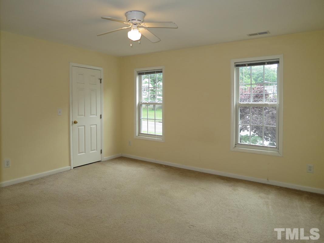 303 West Poplar Avenue, Unit B Carrboro, NC 27510 - Photo 10 of 16 a view of an empty room with a window