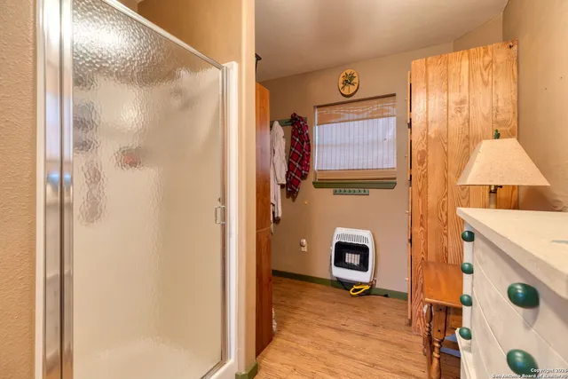 a view of an entryway with wooden floor