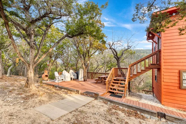 a view of road with large trees