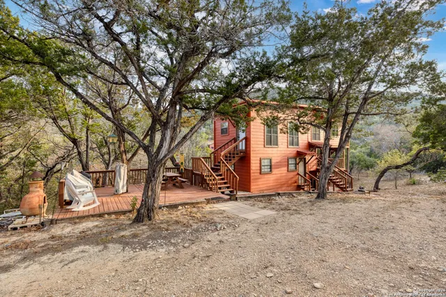 a view of a yard with a tree