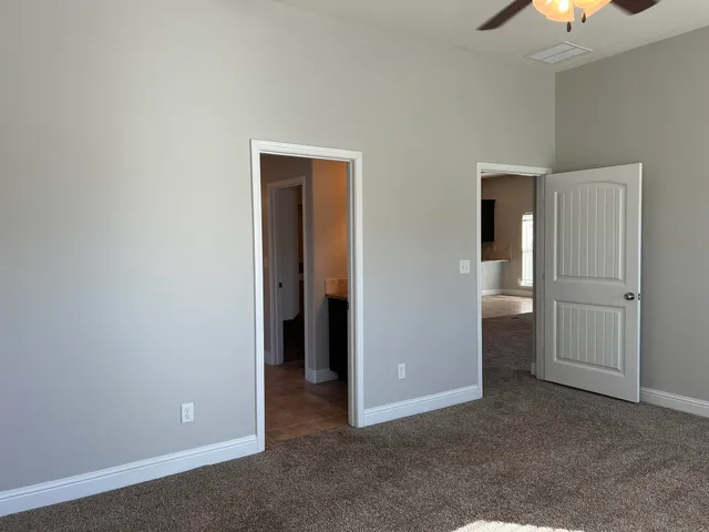 an empty room with a bathroom and a bathroom
