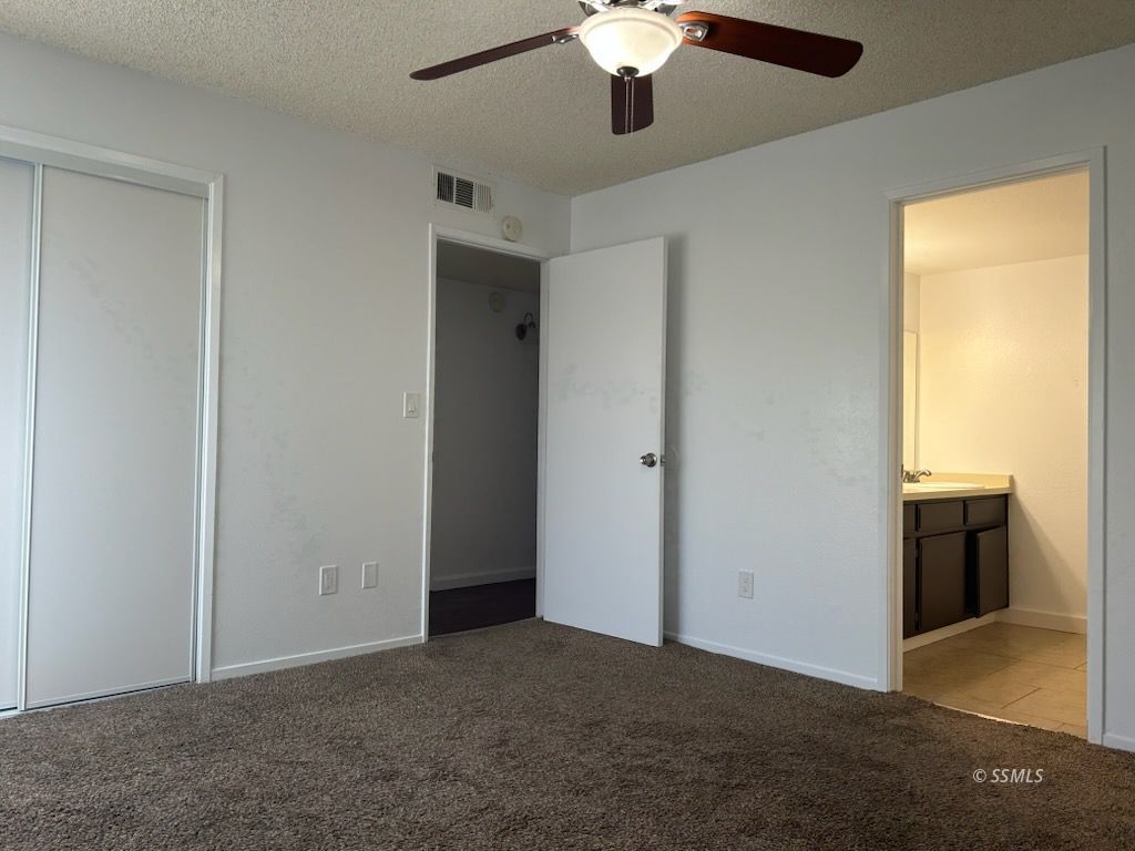 824 C Capehart Court Ridgecrest, CA 93555 - Photo 10 of 11 a view of a livingroom with a chandelier fan