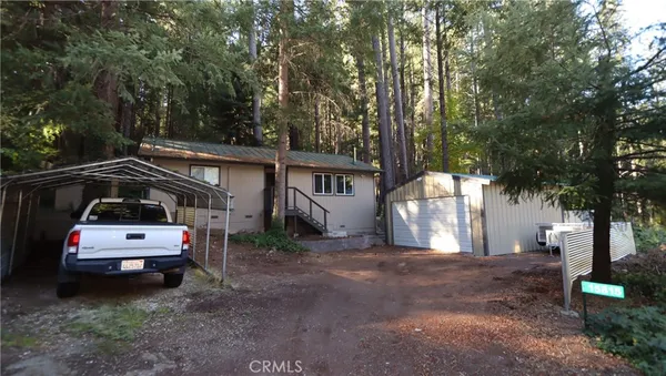 a car parked in front of white house