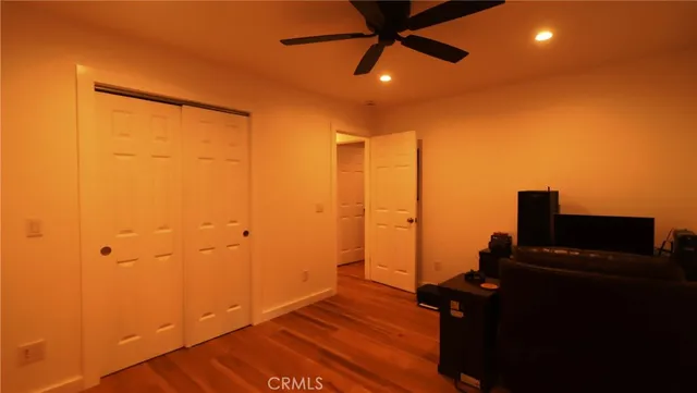 a view of a room with wooden floor