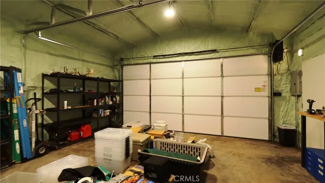 a view of backyard with outdoor seating a patio and plants