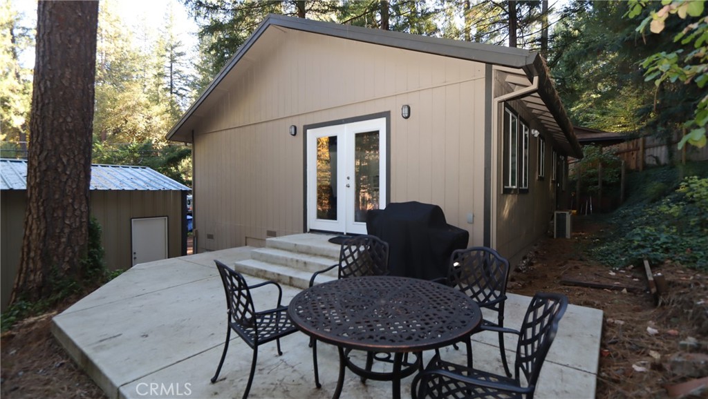 15815 Bottle Rock Road Middletown, CA 95461 - Photo 2 of 20 a view of a house with backyard and sitting area