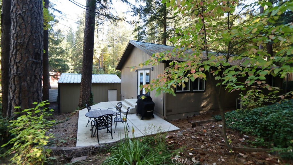 15815 Bottle Rock Road Middletown, CA 95461 - Photo 3 of 20 a view of backyard with a patio and plants