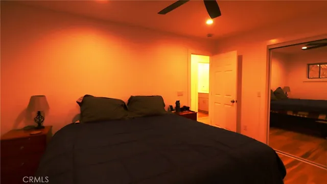 a view of a bedroom with a bed and a chandelier