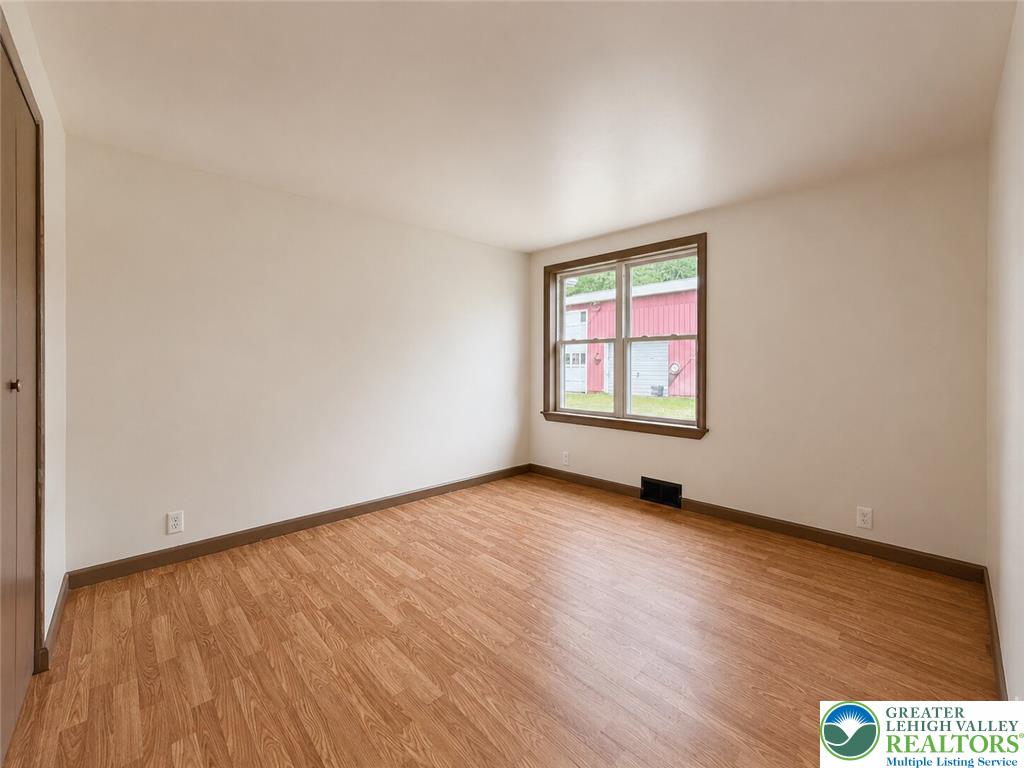 4995 Mountain Road Slatington, PA 18080 - Photo 19 of 30 A well-lit interior space with warm wood flooring offers a comfortable living environment.