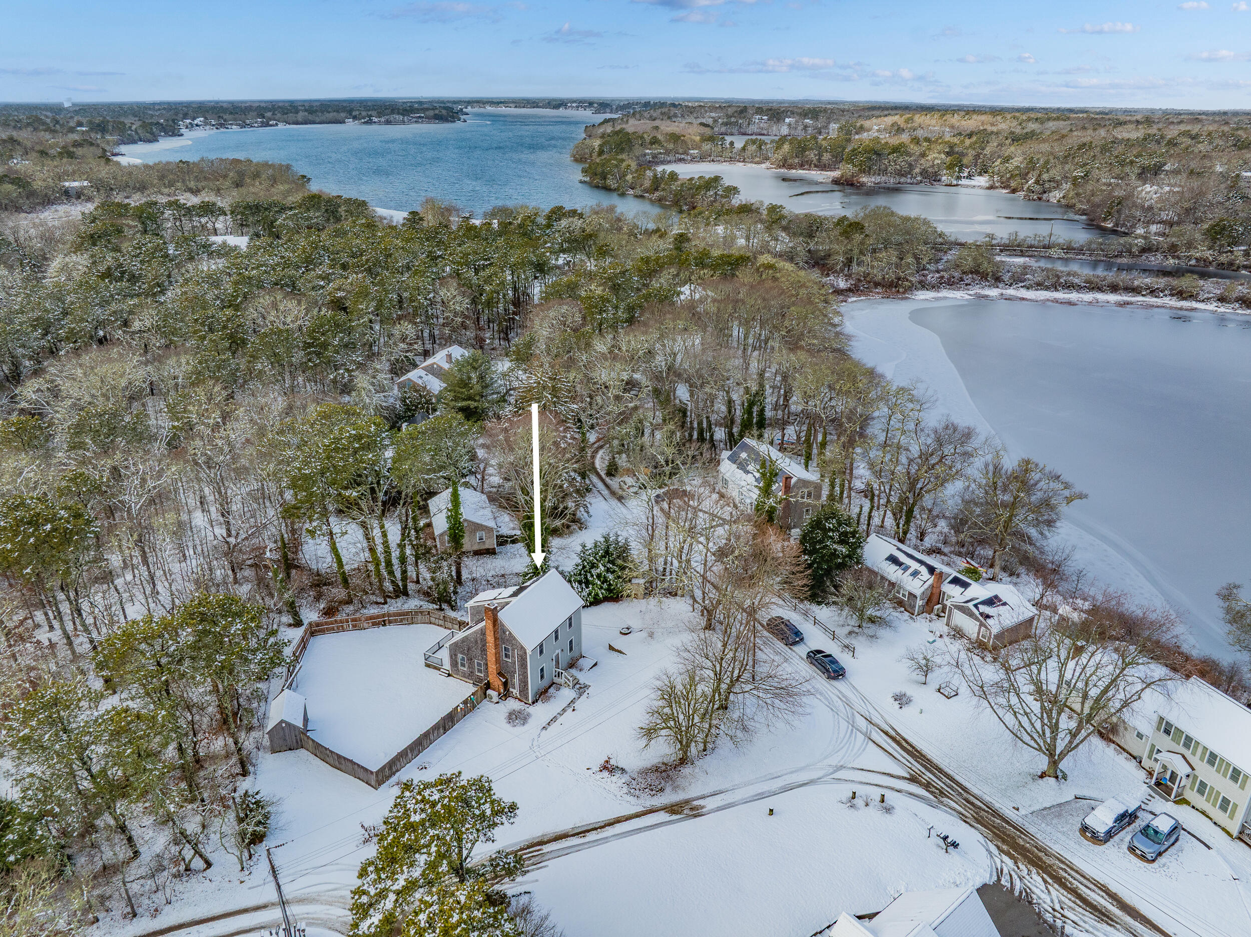 an aerial view of a house with a lake view