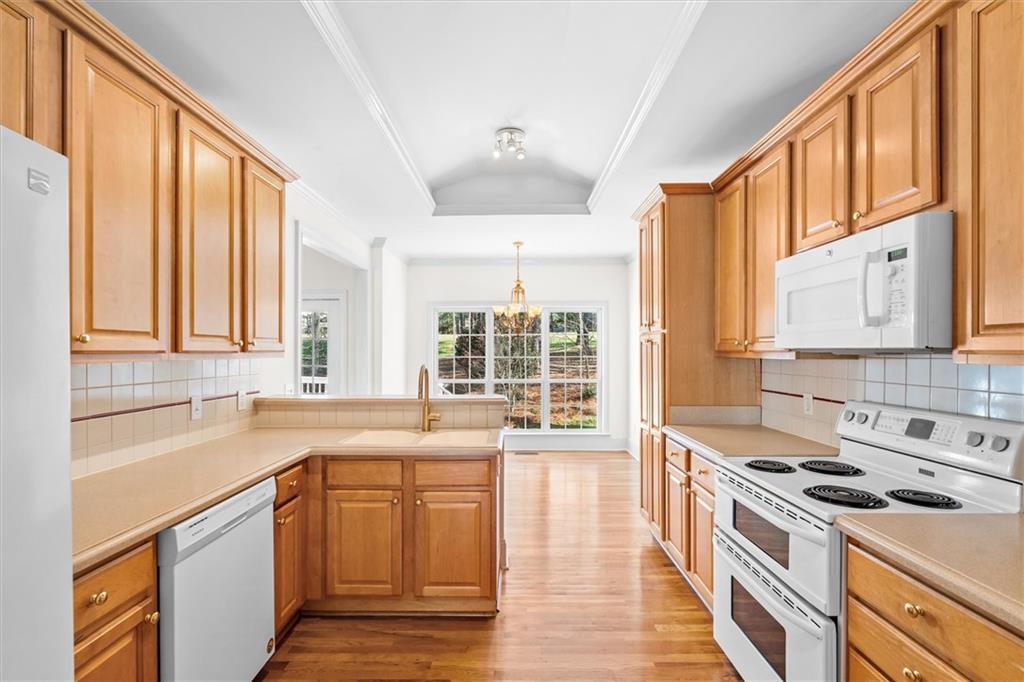 1030 Lakeview Parkway Villa Rica, GA 30180 - Photo 11 of 46 a kitchen with a sink stove top oven and cabinets