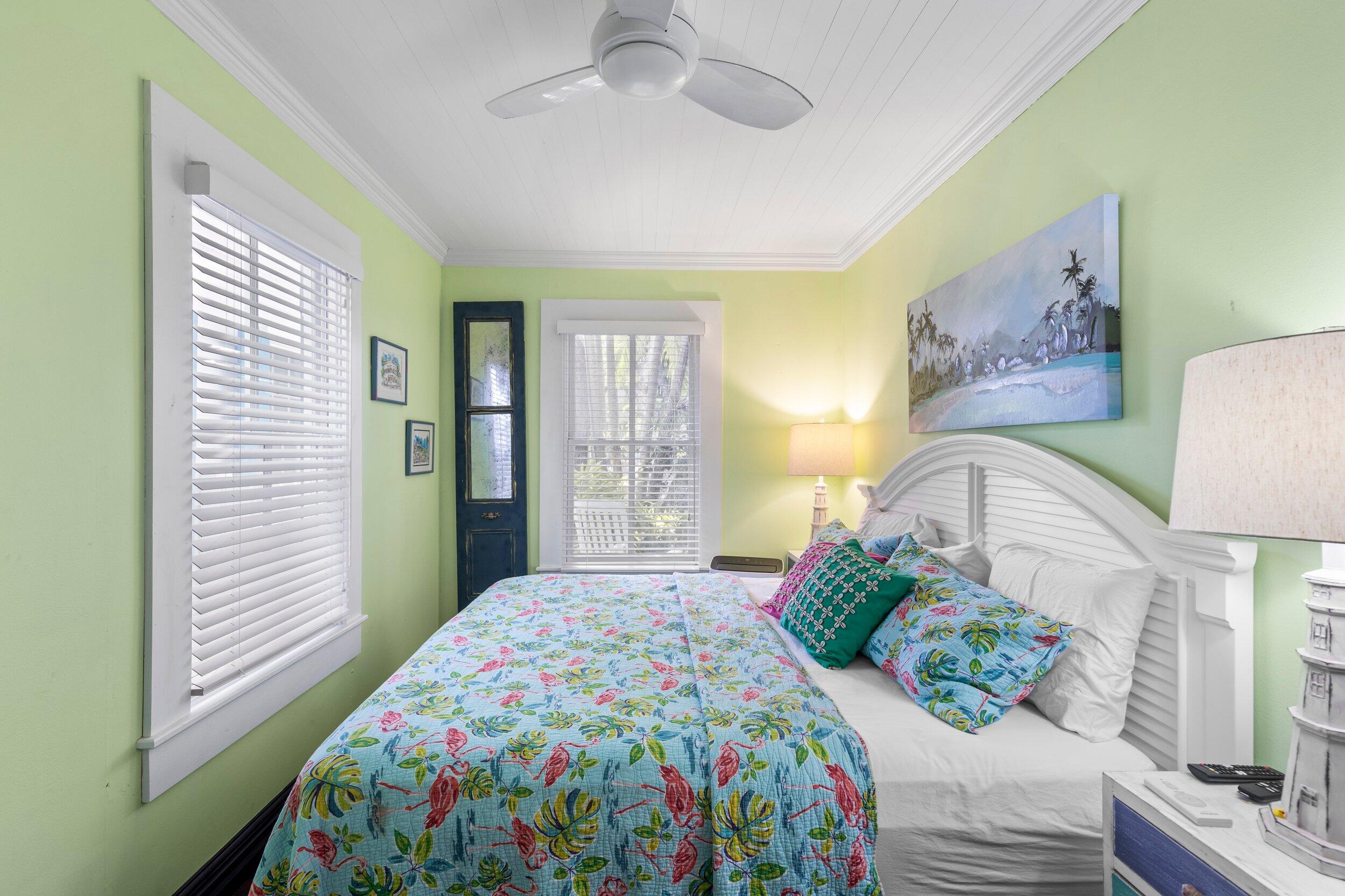 409 Grinnell Street Key West, FL 33040 - Photo 12 of 47 a bedroom with a bed and a window