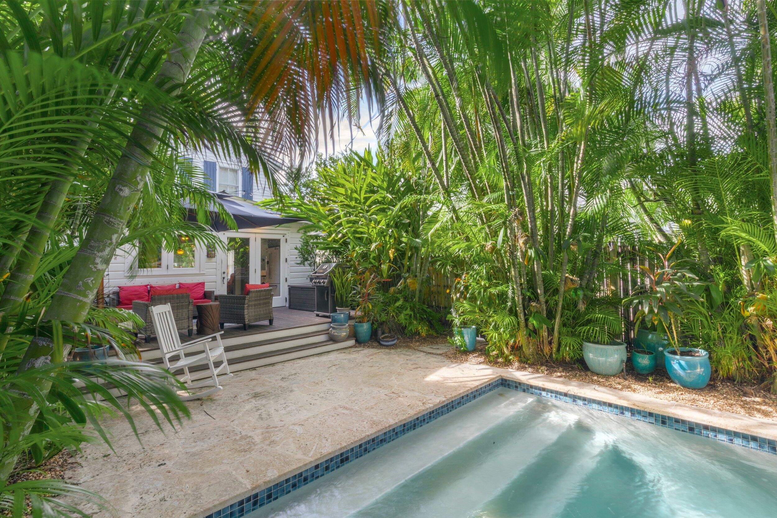 409 Grinnell Street Key West, FL 33040 - Photo 22 of 47 a view of a house with a yard and tree s