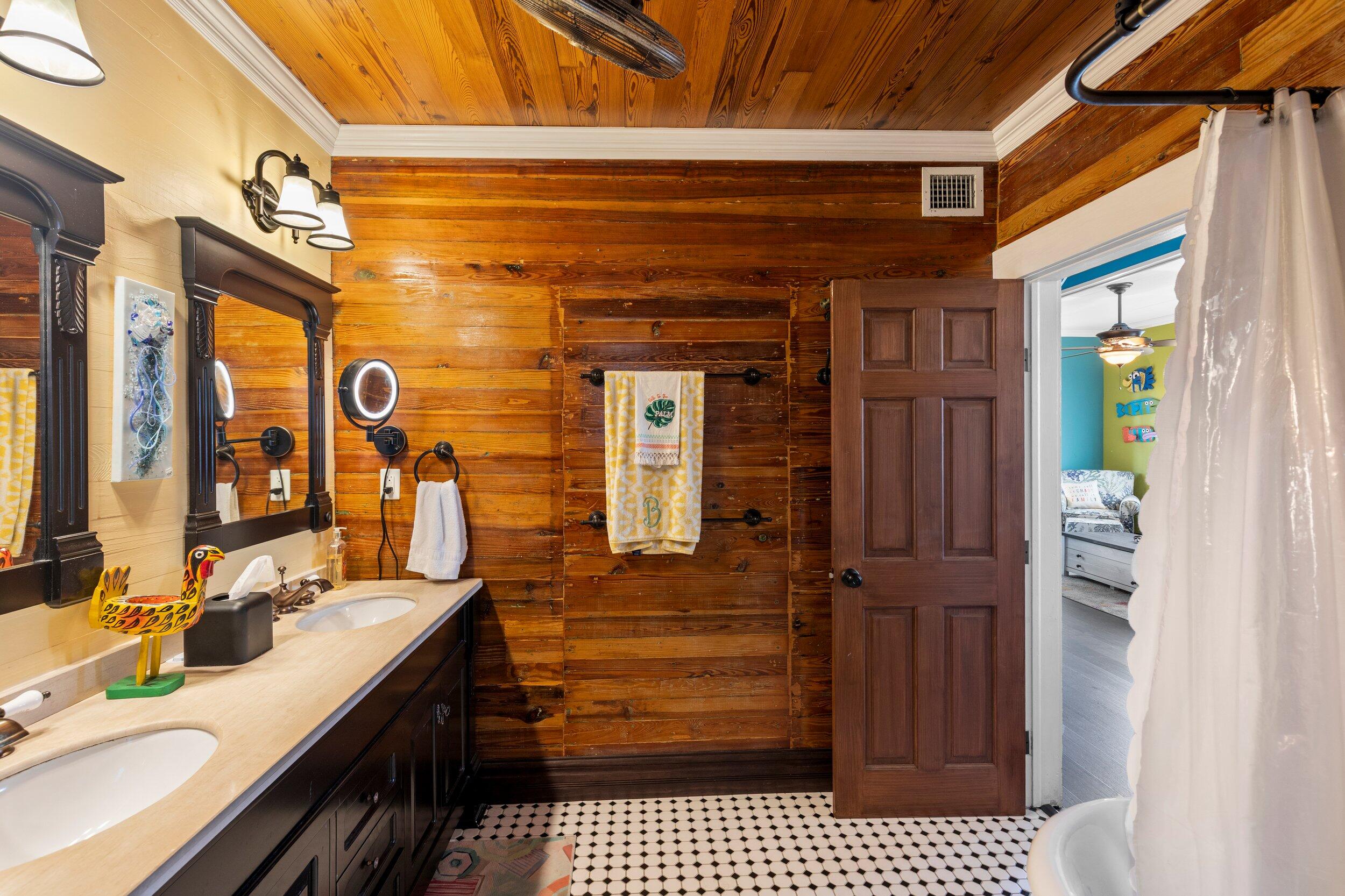409 Grinnell Street Key West, FL 33040 - Photo 28 of 47 a bathroom with a sink a mirror and shower