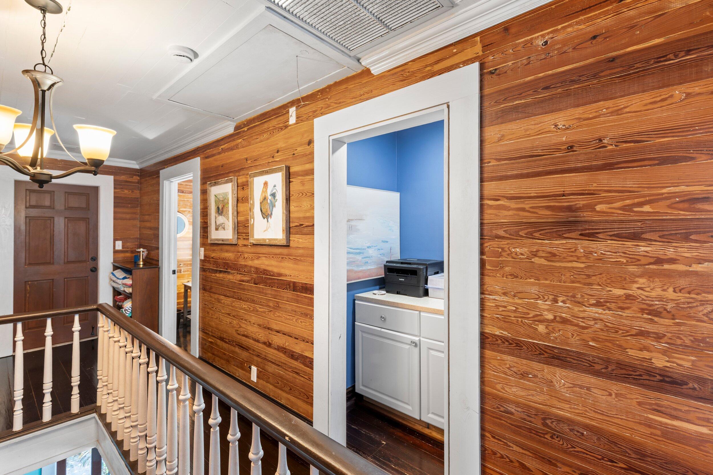 409 Grinnell Street Key West, FL 33040 - Photo 37 of 47 a view of a hallway with wooden floor and staircase