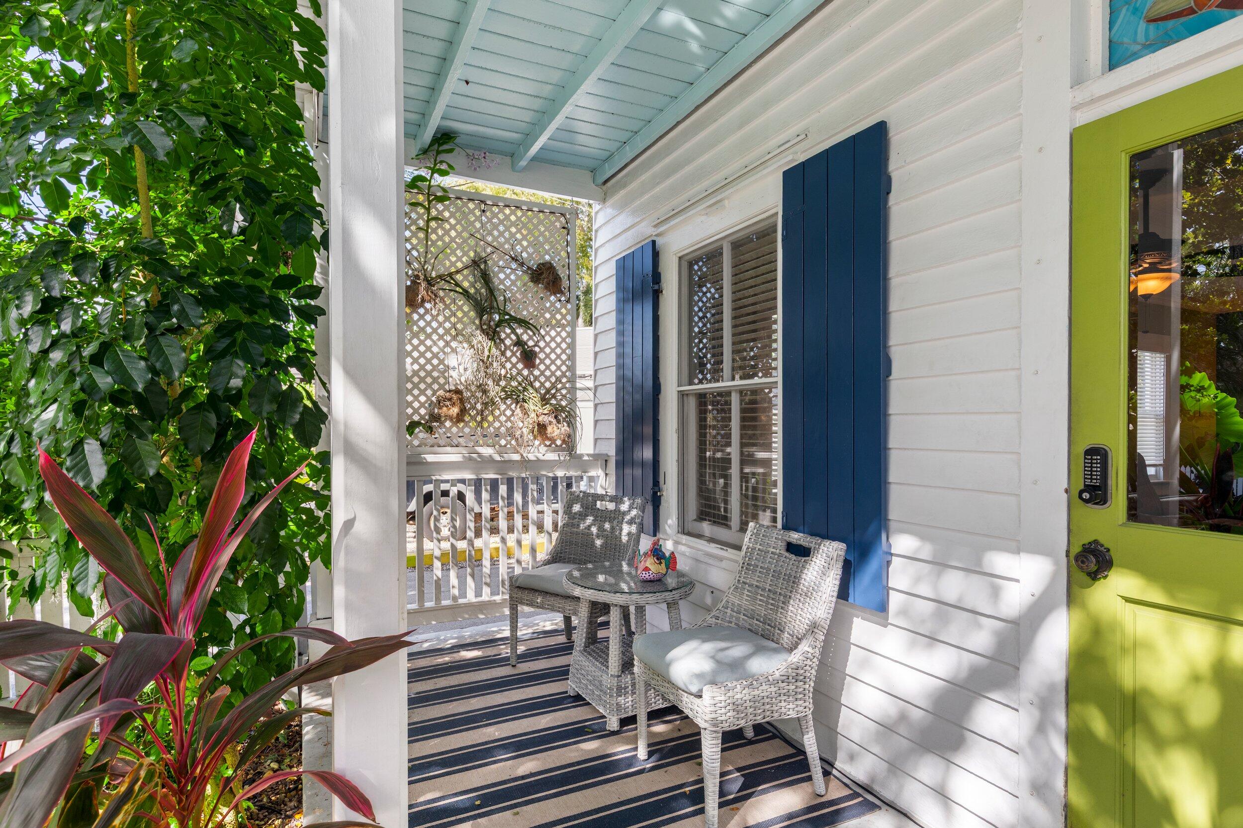 409 Grinnell Street Key West, FL 33040 - Photo 43 of 47 a view of balcony with wooden floor and outdoor seating