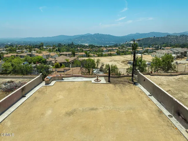 a view of a swimming pool with a table and chairs