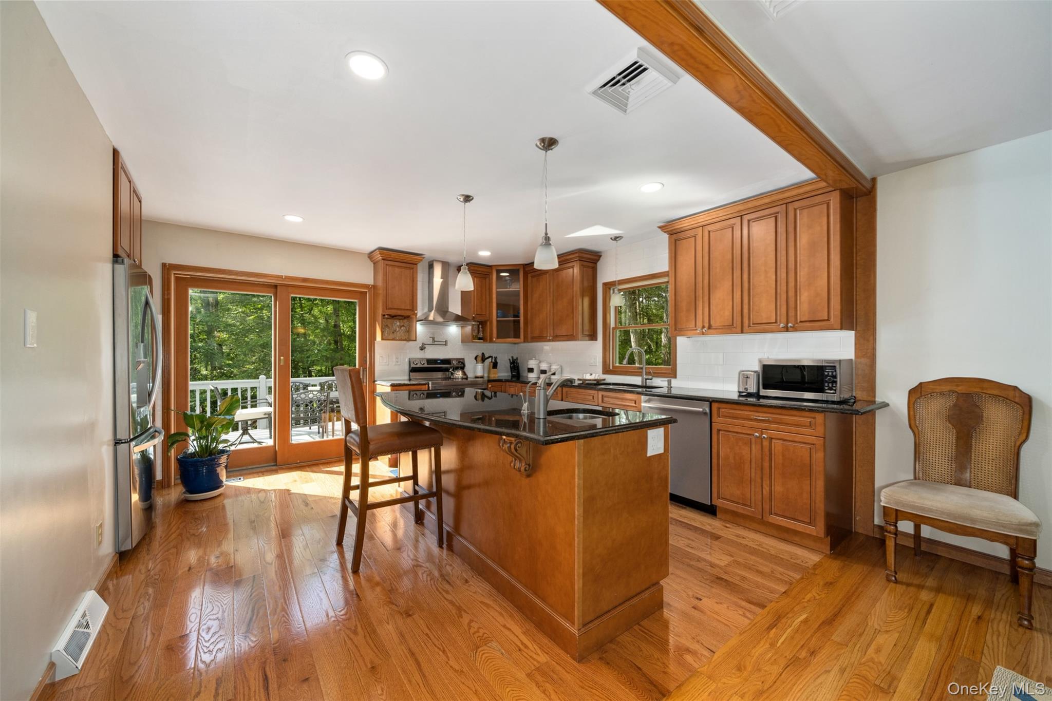 39 Pitio Road Glen Spey, NY 12737 - Photo 11 of 45 a kitchen with stainless steel appliances granite countertop a stove and a refrigerator