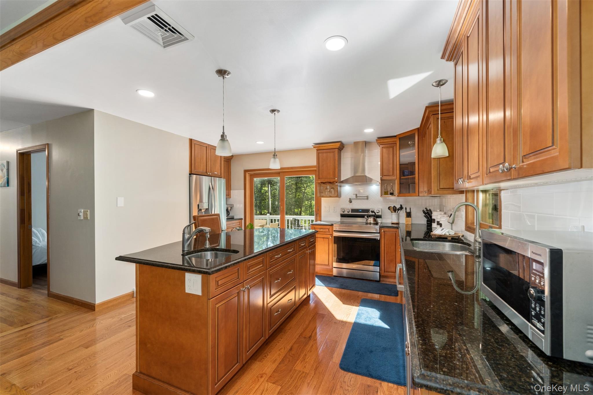 39 Pitio Road Glen Spey, NY 12737 - Photo 12 of 45 a kitchen with stainless steel appliances granite countertop a stove a sink and a refrigerator