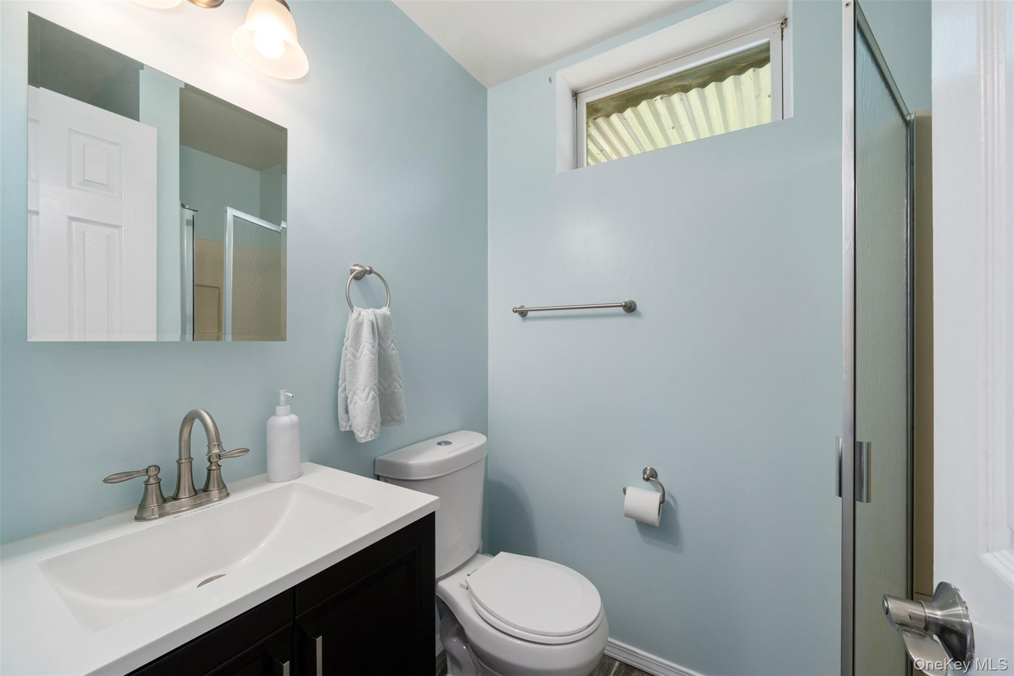 39 Pitio Road Glen Spey, NY 12737 - Photo 19 of 45 a bathroom with a sink vanity mirror and toilet