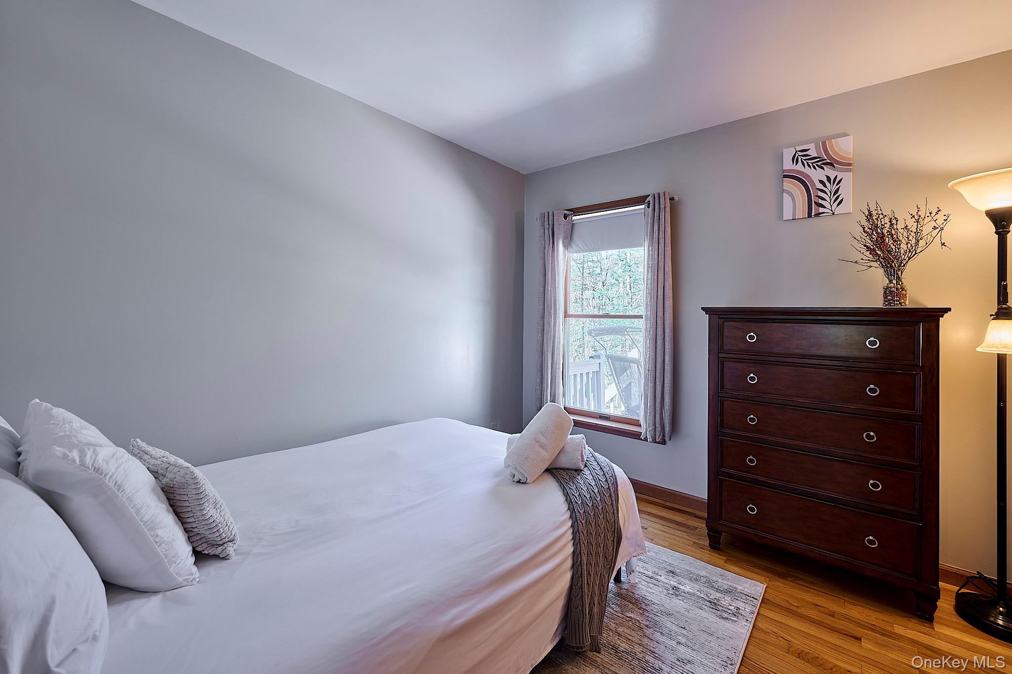 39 Pitio Road Glen Spey, NY 12737 - Photo 20 of 45 a bedroom with a bed and a window