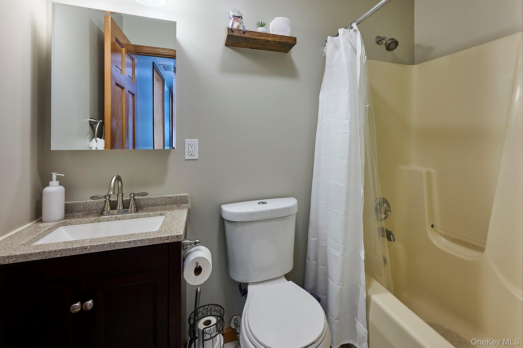 39 Pitio Road Glen Spey, NY 12737 - Photo 21 of 45 a bathroom with a granite countertop sink toilet and shower