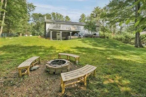 an aerial view of a house with outdoor space and a lake view