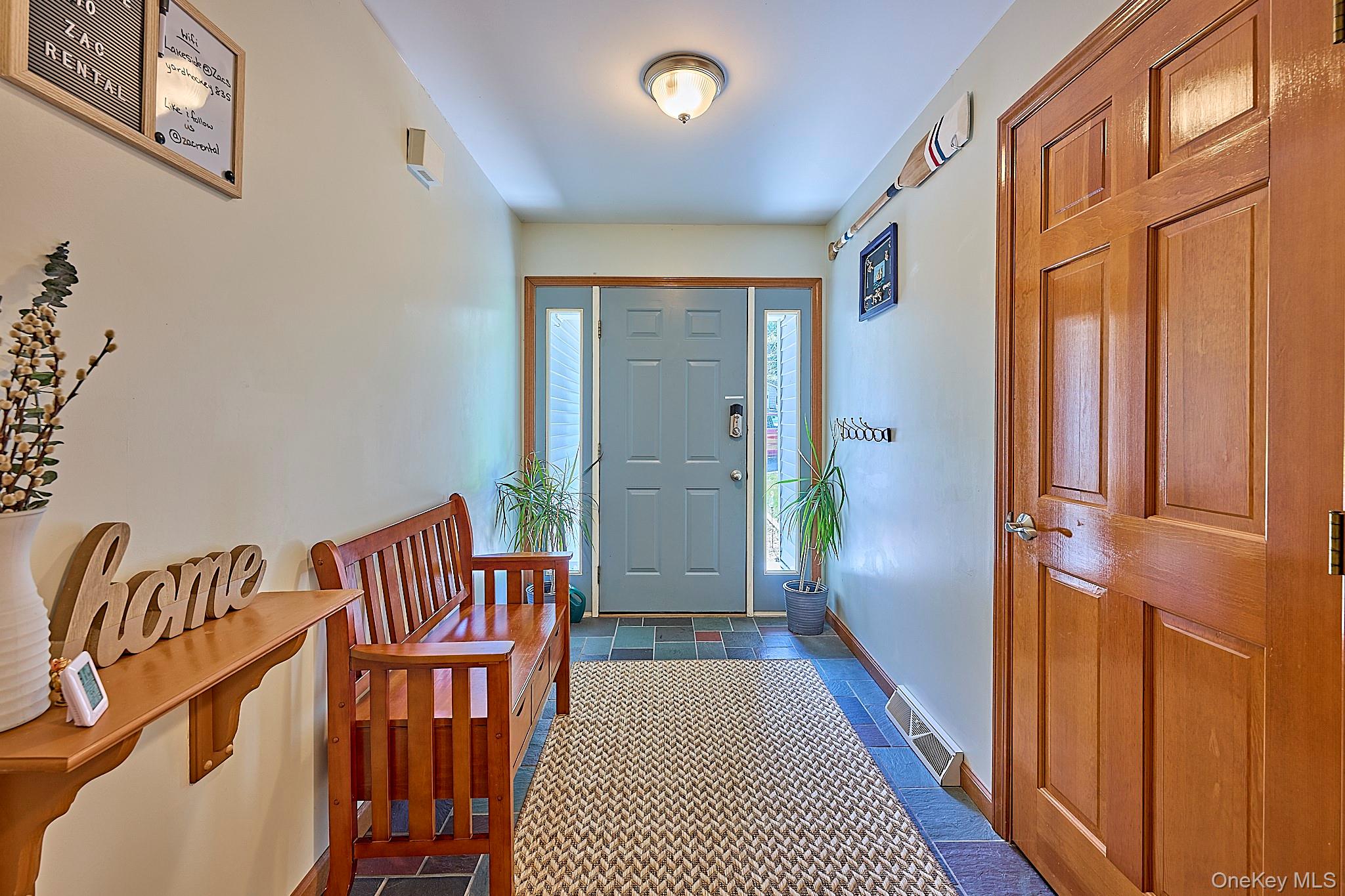 39 Pitio Road Glen Spey, NY 12737 - Photo 6 of 45 a view of a hallway with wooden floor and windows
