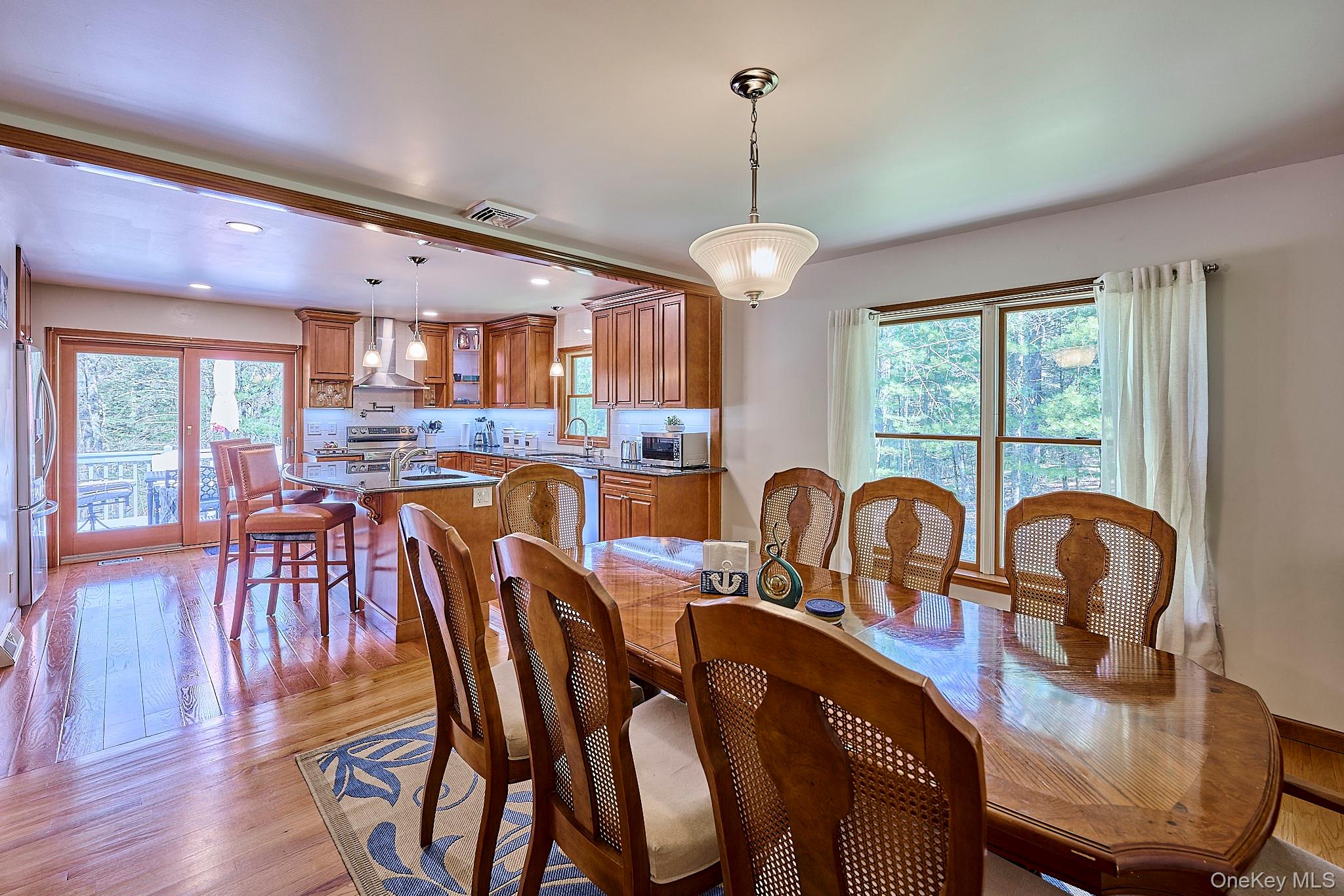 39 Pitio Road Glen Spey, NY 12737 - Photo 9 of 45 a view of a dining room with furniture window and wooden floor