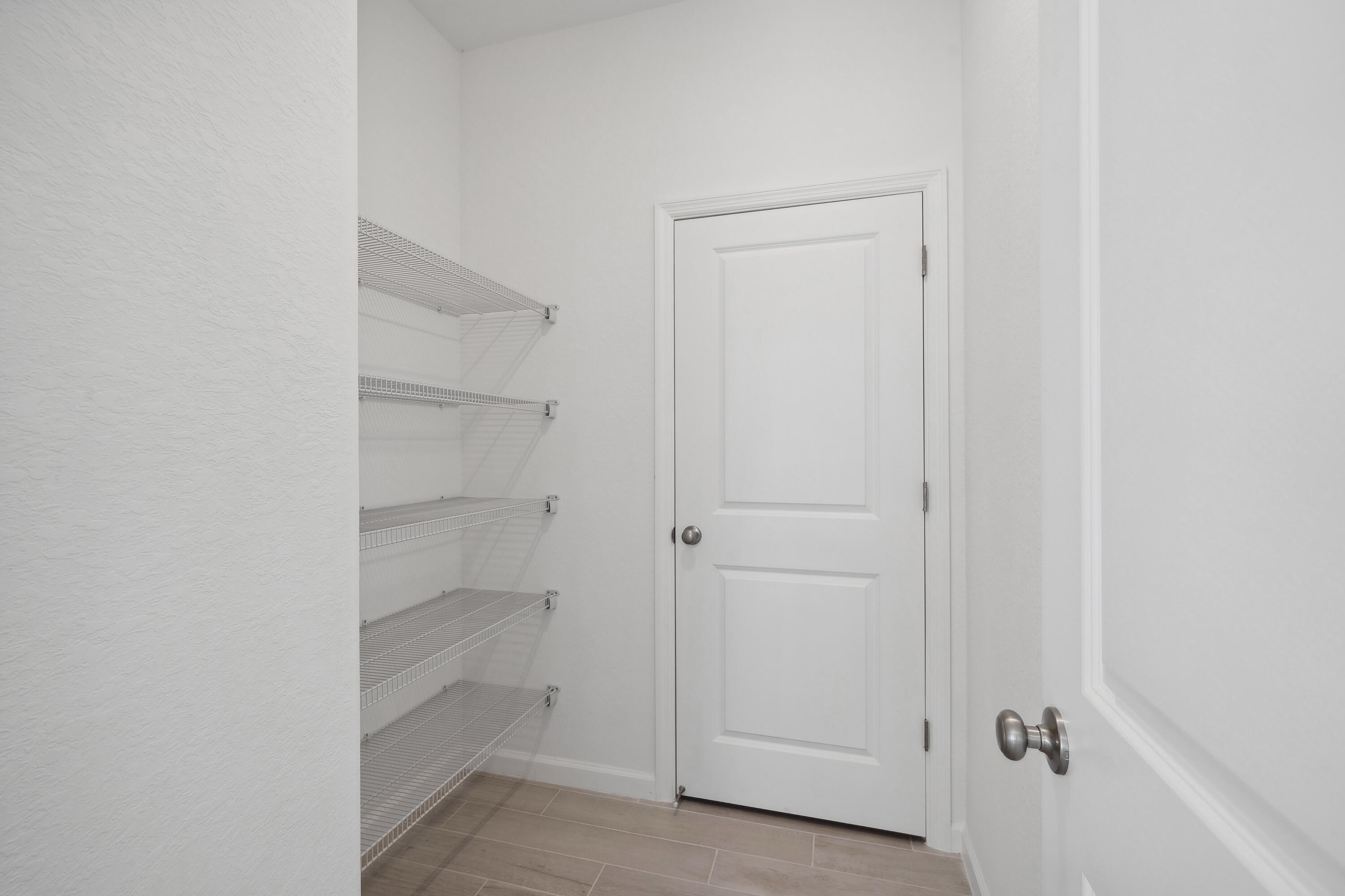 10099 Dreamweaver Road, Unit 51 Port St. Lucie, FL 34987 - Photo 12 of 36 a view of an empty walk in closet