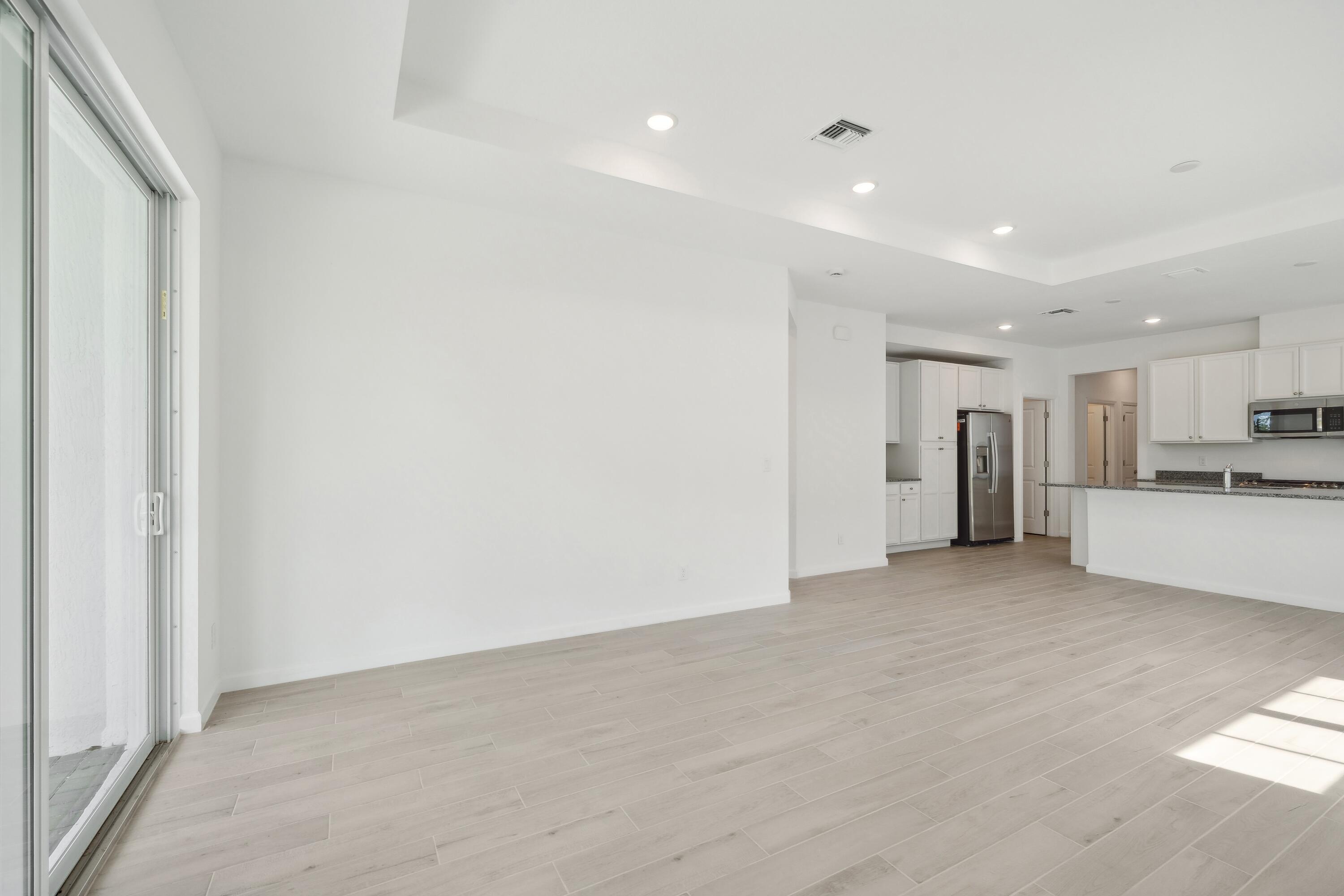 10099 Dreamweaver Road, Unit 51 Port St. Lucie, FL 34987 - Photo 15 of 36 a view of empty room with kitchen